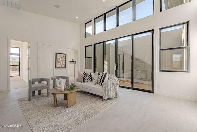 living room with a high ceiling