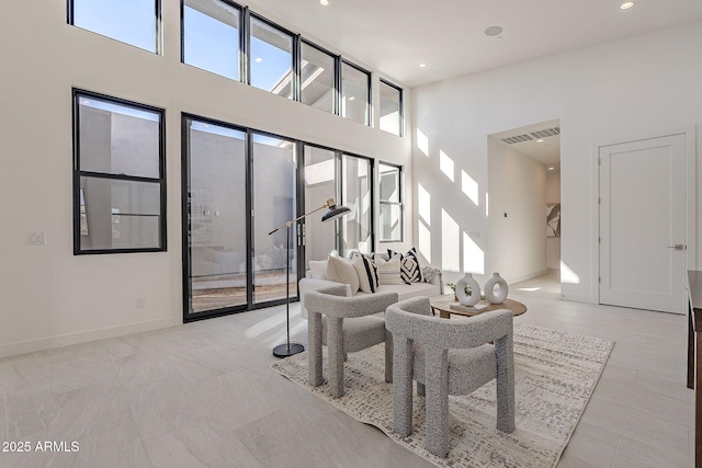 living room featuring a high ceiling