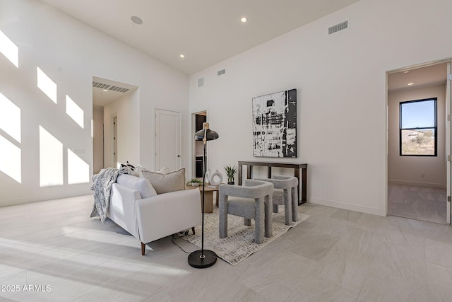 living room featuring high vaulted ceiling