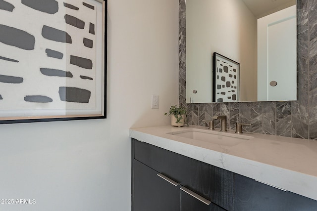 bathroom with tasteful backsplash and vanity