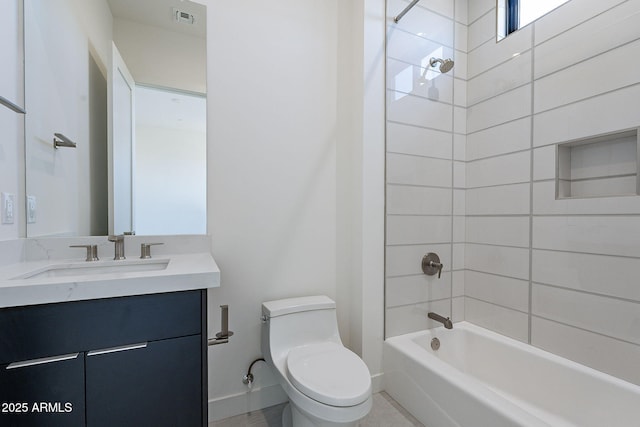 full bathroom featuring vanity, tiled shower / bath combo, and toilet