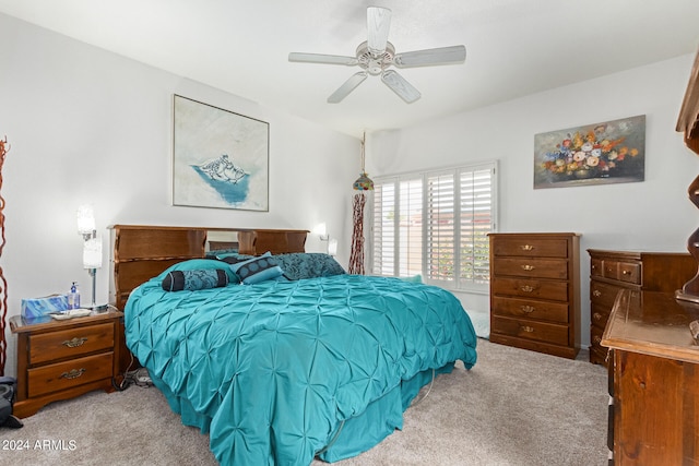 bedroom with ceiling fan and light colored carpet