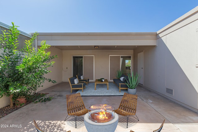 view of patio featuring a fire pit