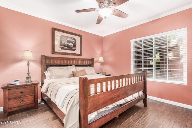 bedroom with ceiling fan, hardwood / wood-style floors, and ornamental molding