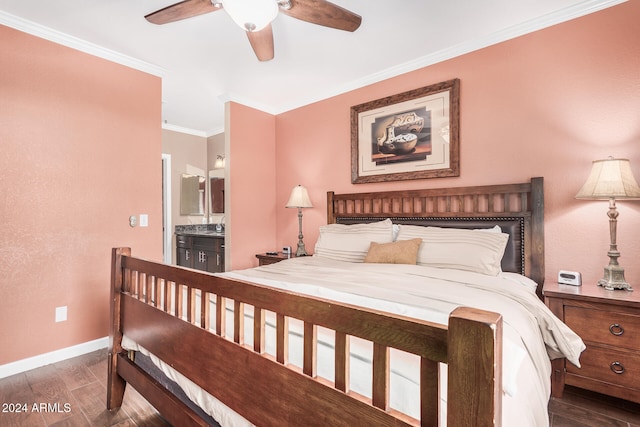 bedroom featuring ceiling fan, dark hardwood / wood-style flooring, ornamental molding, and connected bathroom