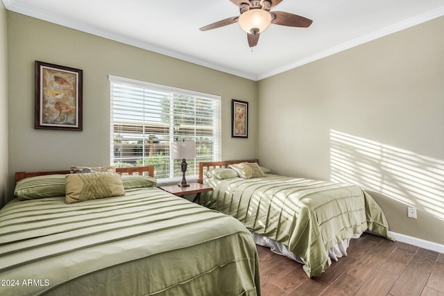 bedroom featuring ceiling fan, ornamental molding, and dark wood-type flooring