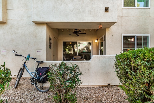 entrance to property with ceiling fan