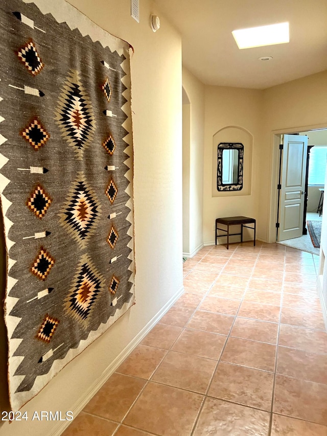 hall featuring tile patterned floors