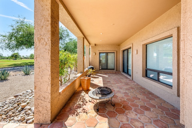 view of patio / terrace featuring a fire pit