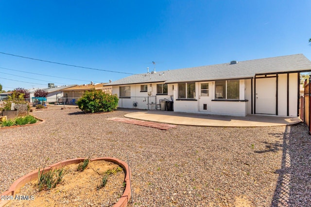 back of house with a patio area and fence