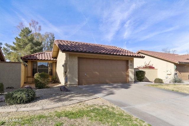 mediterranean / spanish house featuring a garage