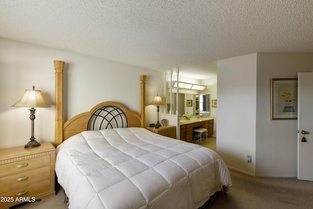 bedroom with light carpet, connected bathroom, and a textured ceiling