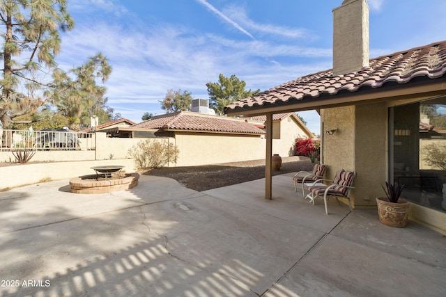 view of patio / terrace with an outdoor fire pit