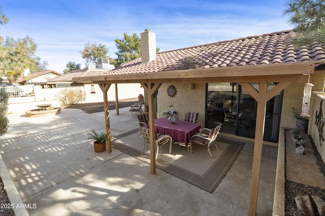 view of patio / terrace featuring a fire pit