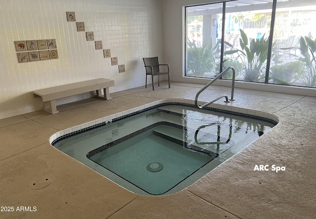 view of swimming pool featuring an indoor in ground hot tub