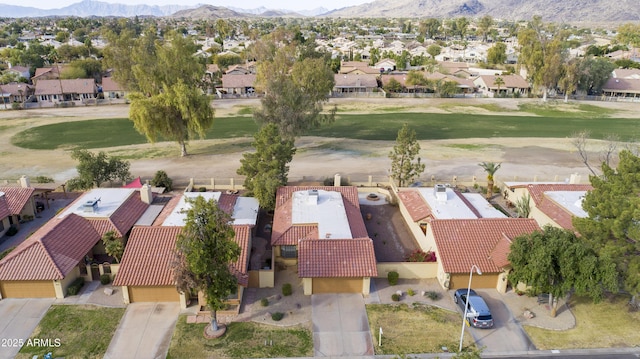 birds eye view of property featuring a mountain view