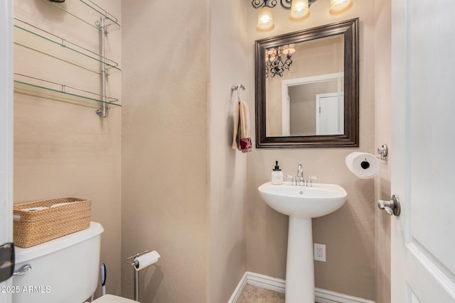 bathroom featuring sink and toilet