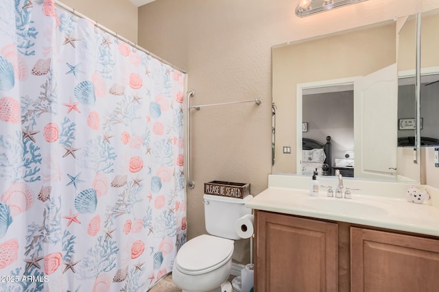 bathroom with toilet, vanity, and a shower with curtain