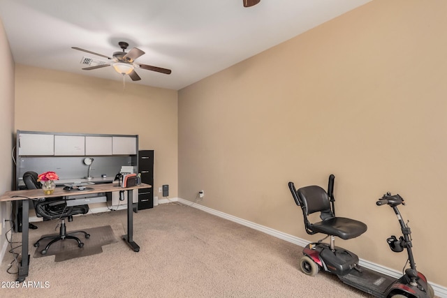 home office with light colored carpet and ceiling fan