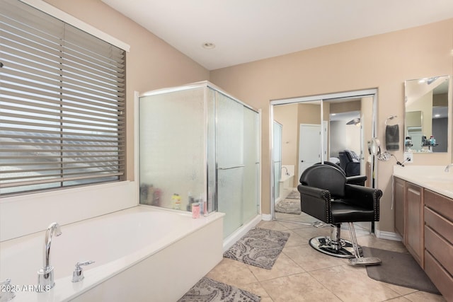 bathroom featuring shower with separate bathtub, tile patterned floors, and vanity