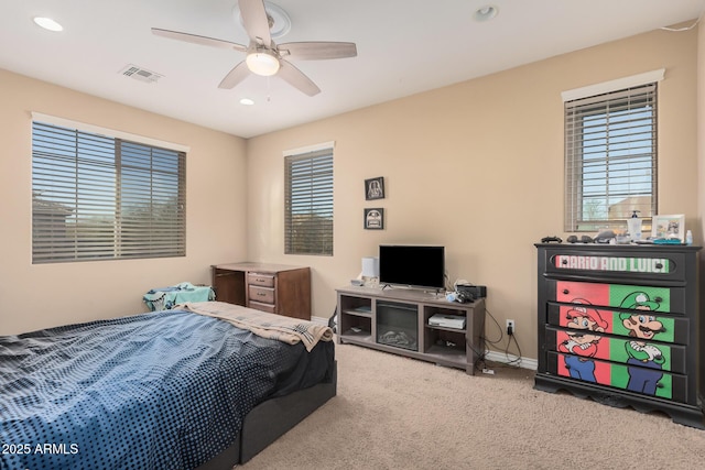 carpeted bedroom with ceiling fan