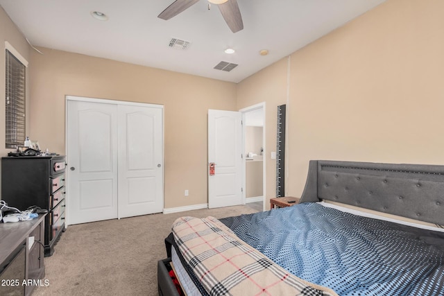 carpeted bedroom featuring a closet and ceiling fan