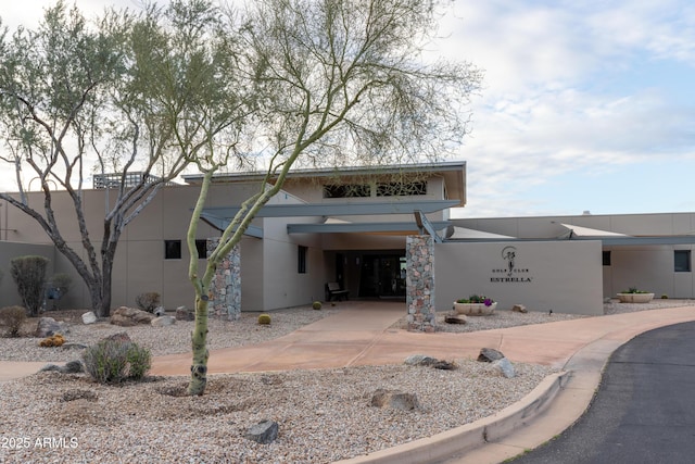 view of front of property with a carport