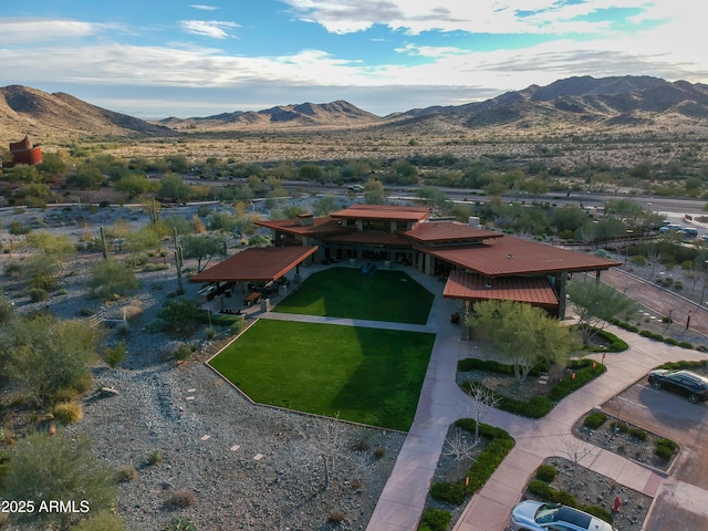 birds eye view of property with a mountain view