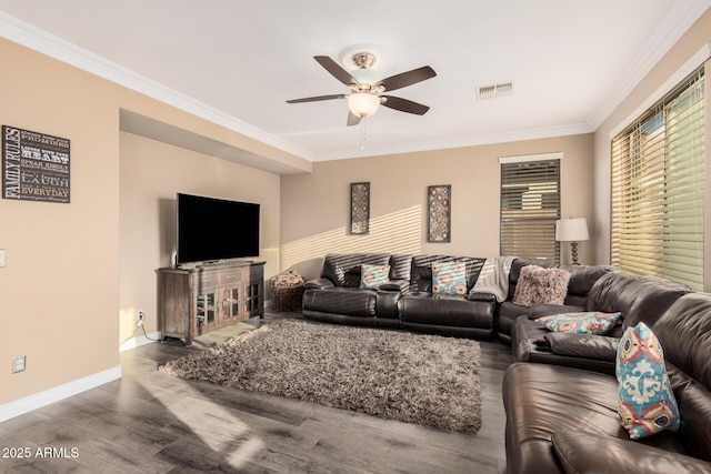 living room with crown molding, hardwood / wood-style floors, and ceiling fan