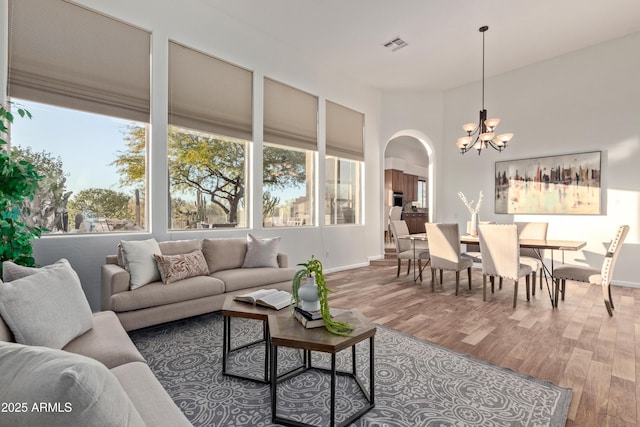 living room featuring hardwood / wood-style floors and a chandelier