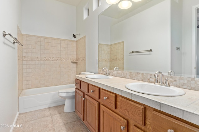 full bathroom with toilet, shower / washtub combination, vanity, and backsplash