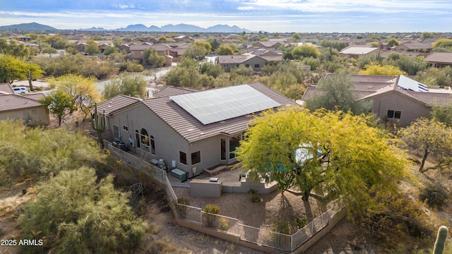 birds eye view of property with a mountain view