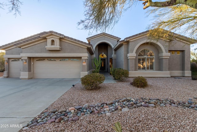 mediterranean / spanish-style house featuring a garage