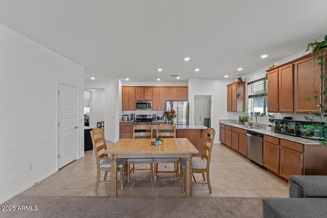 dining area with light colored carpet, recessed lighting, and light tile patterned flooring