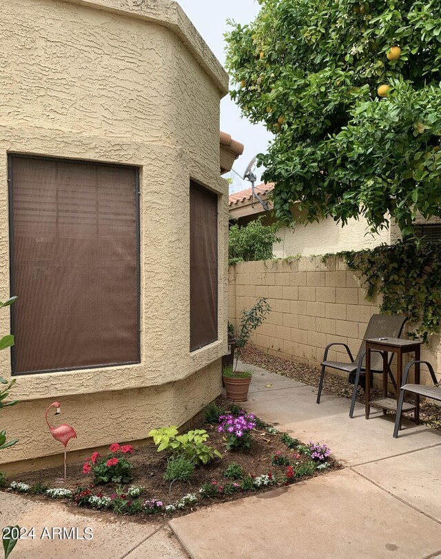 view of side of home featuring a patio