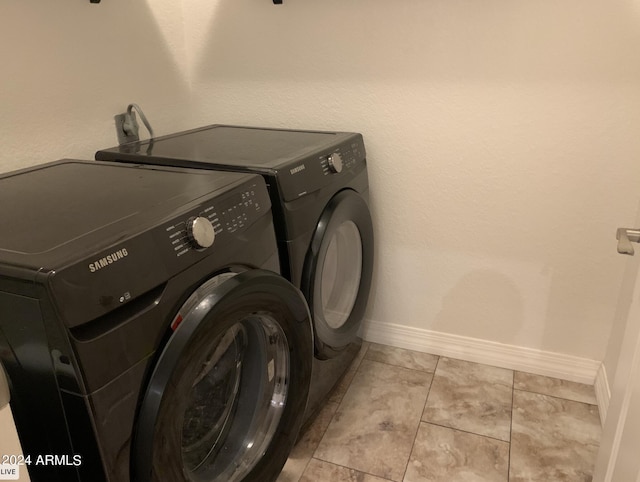 clothes washing area featuring washing machine and clothes dryer