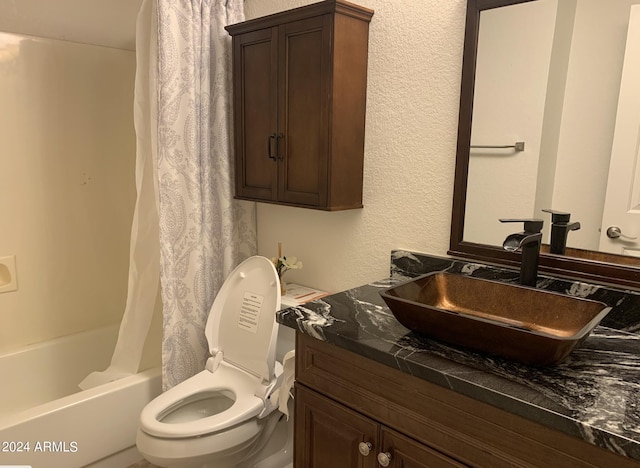 full bathroom with vanity, shower / bath combo with shower curtain, and toilet