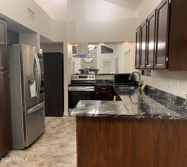 kitchen featuring sink, ventilation hood, vaulted ceiling, appliances with stainless steel finishes, and kitchen peninsula