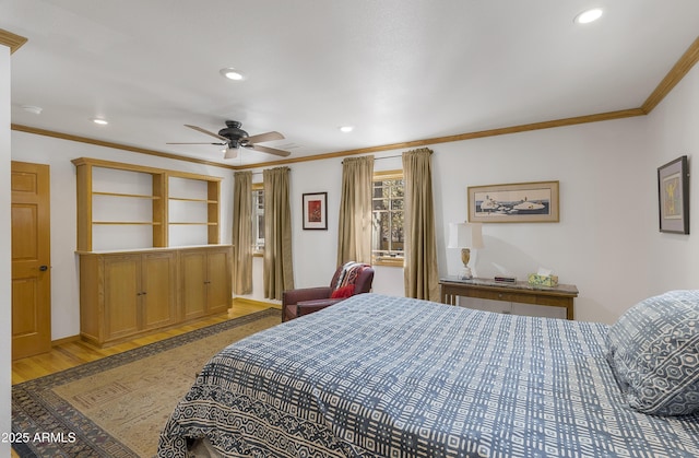 bedroom with ceiling fan, recessed lighting, light wood-type flooring, and crown molding