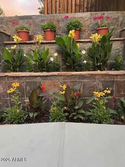 yard at dusk featuring fence