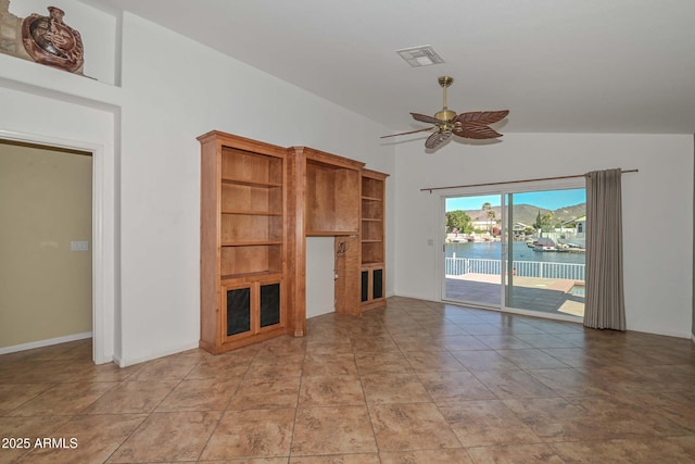 5226 W Pontiac Dr, Glendale, AZ 85308 - unfurnished living room with visible vents, a ceiling fan, and vaulted ceiling