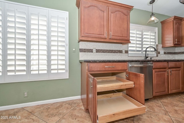 5226 W Pontiac Dr, Glendale, AZ 85308 - kitchen with baseboards, light tile patterned floors, decorative backsplash, dishwasher, and hanging light fixtures
