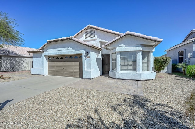 5226 W Pontiac Dr, Glendale, AZ 85308 - view of front of property with a garage, stucco siding, concrete driveway, and a tile roof