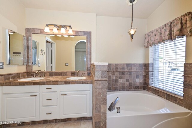 5226 W Pontiac Dr, Glendale, AZ 85308 - bathroom with a garden tub, double vanity, and a sink