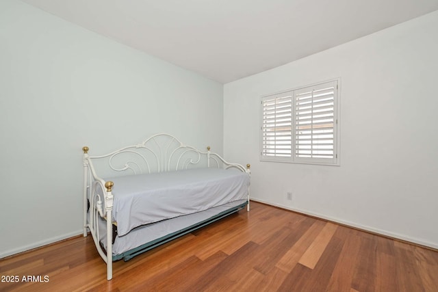 5226 W Pontiac Dr, Glendale, AZ 85308 - bedroom featuring baseboards and wood finished floors