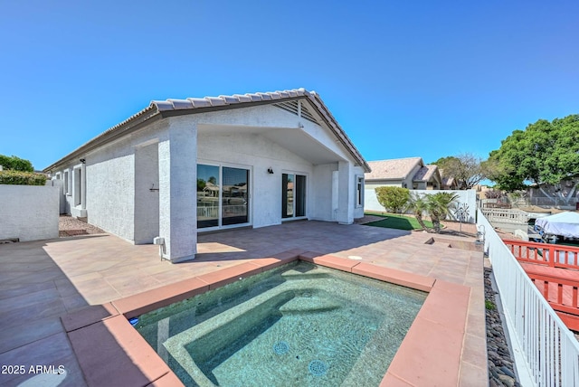 5226 W Pontiac Dr, Glendale, AZ 85308 - back of house featuring a fenced backyard, a tile roof, a patio, stucco siding, and an in ground hot tub