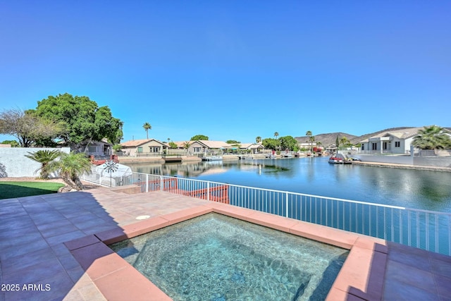 5226 W Pontiac Dr, Glendale, AZ 85308 - view of pool featuring a water view, an in ground hot tub, a patio, and a residential view