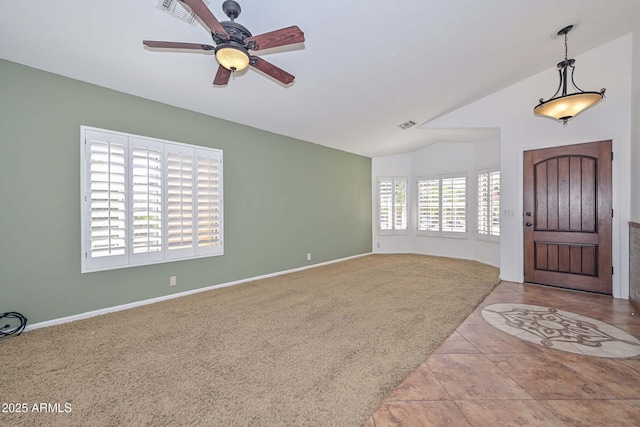 5226 W Pontiac Dr, Glendale, AZ 85308 - carpeted entryway with ceiling fan, vaulted ceiling, visible vents, and tile patterned flooring
