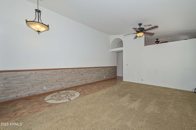 5226 W Pontiac Dr, Glendale, AZ 85308 - carpeted spare room with visible vents, ceiling fan, and a wainscoted wall