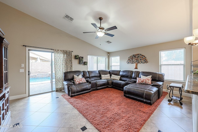 living room with light tile patterned floors, ceiling fan, and lofted ceiling